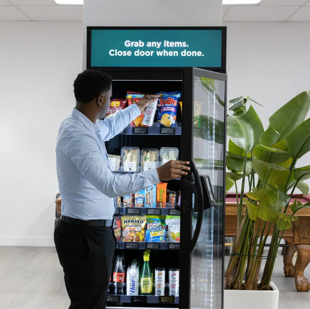 A modern, cashless smart fridge vending machine with AI checkout technology, installed in a Denver corporate breakroom by Viola Vending.